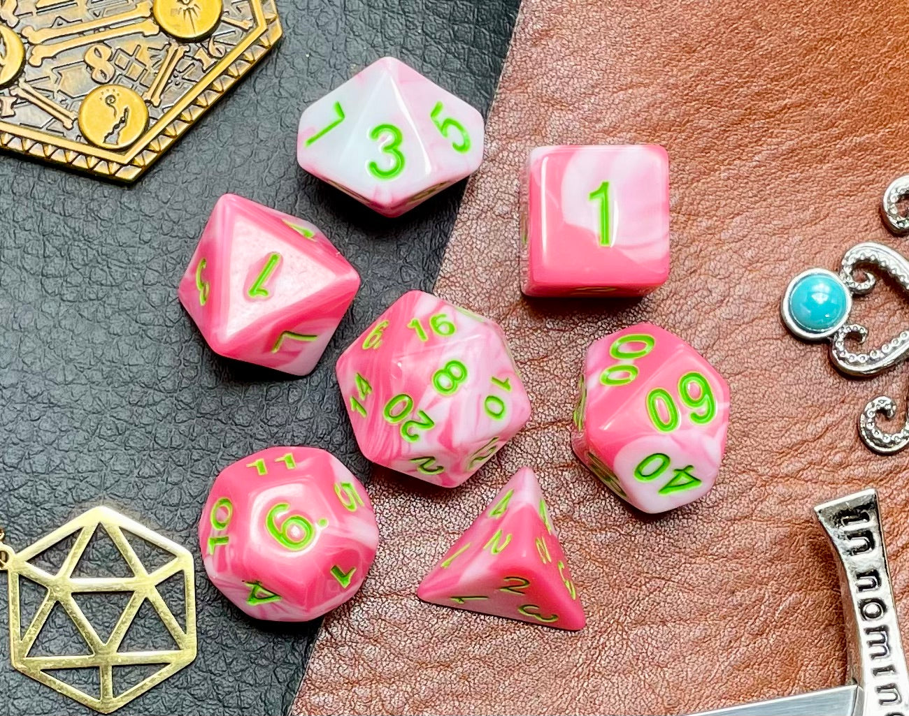 Elemental Pink and White resin polyhedral dice set.  Awaken the elements with these fantastic resin dice. Combining vibrant pink with white swirls; each dice has its own unique pattern.  They are standard 16mm polyhedral dice sets perfect for Tabletop games and RPG's such as pathfinder or dungeons and dragons.  This set includes one of each D20, D12, D10, D%, D8, D6, D4.