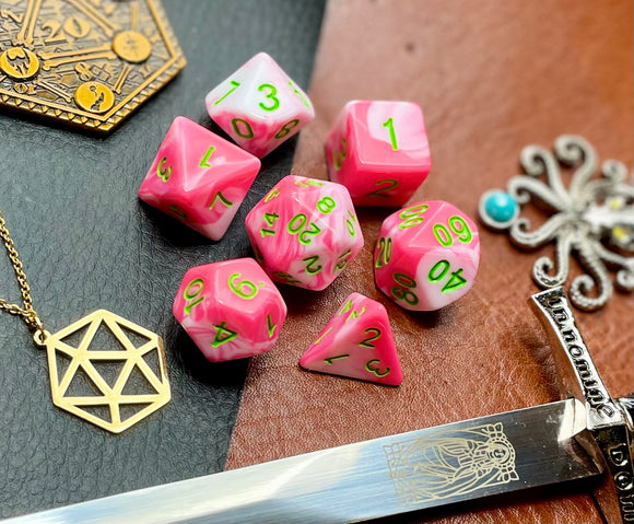 Elemental Pink and White resin polyhedral dice set.  Awaken the elements with these fantastic resin dice. Combining vibrant pink with white swirls; each dice has its own unique pattern.  They are standard 16mm polyhedral dice sets perfect for Tabletop games and RPG's such as pathfinder or dungeons and dragons.  This set includes one of each D20, D12, D10, D%, D8, D6, D4.