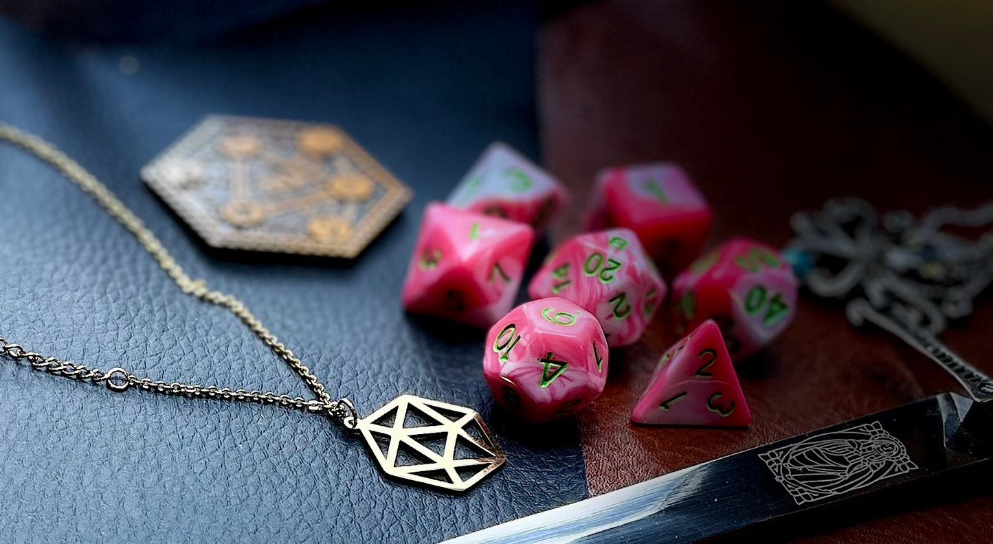 Elemental Pink and White resin polyhedral dice set.  Awaken the elements with these fantastic resin dice. Combining vibrant pink with white swirls; each dice has its own unique pattern.  They are standard 16mm polyhedral dice sets perfect for Tabletop games and RPG's such as pathfinder or dungeons and dragons.  This set includes one of each D20, D12, D10, D%, D8, D6, D4.