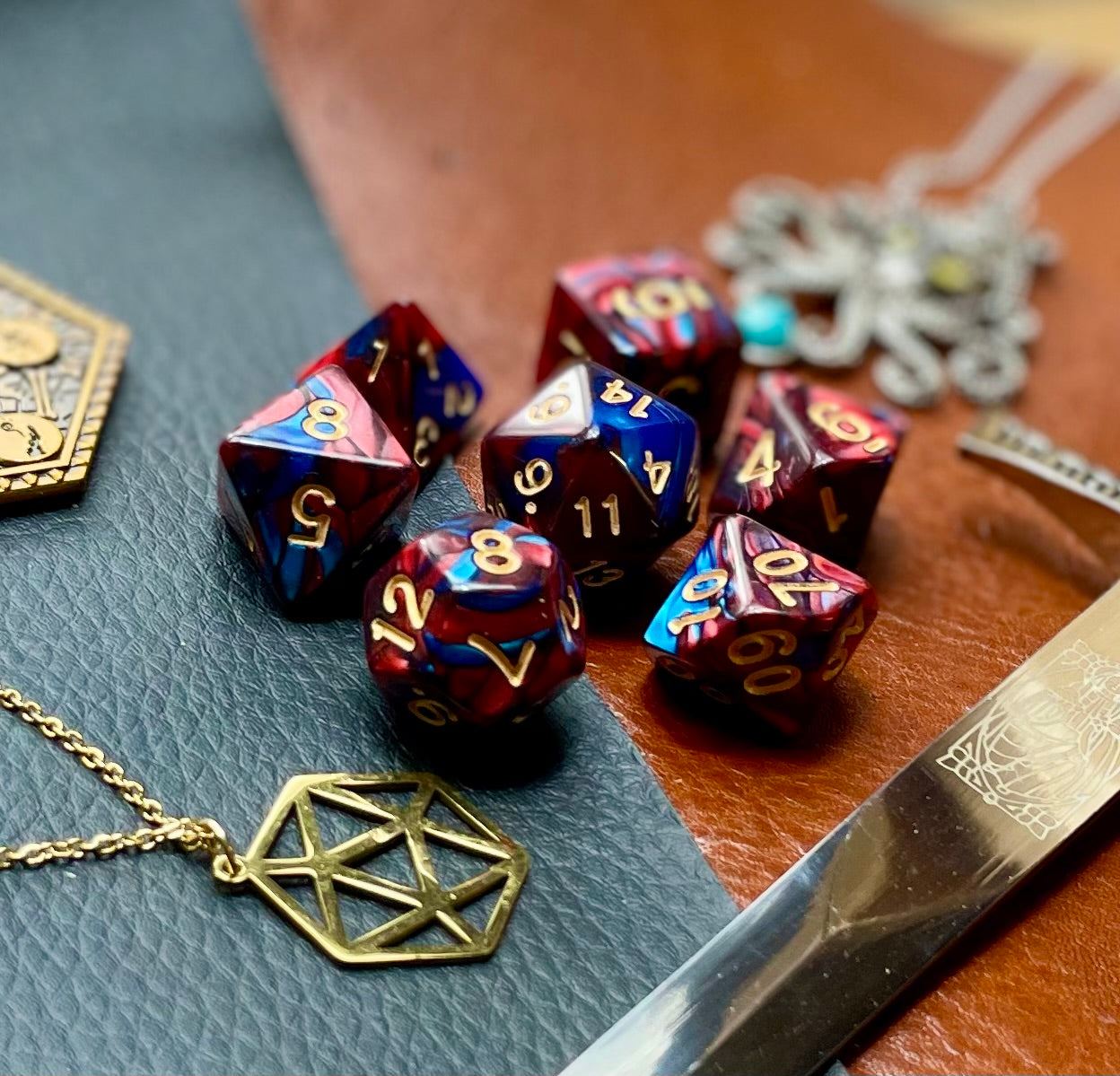 Elemental Red and Blue resin polyhedral dice set.  Awaken the elements with these fantastic resin dice. Combining vibrant red and blue swirls; each dice has its own unique pattern.  They are standard 16mm polyhedral dice sets perfect for Tabletop games and RPG's such as pathfinder or dungeons and dragons.  This set includes one of each D20, D12, D10, D%, D8, D6, D4.