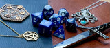 Elemental Steel and Blue resin polyhedral dice set.  Awaken the elements with these fantastic resin dice. Combining vibrant blue and steel swirls; each dice has its own unique pattern.  They are standard 16mm polyhedral dice sets perfect for Tabletop games and RPG's such as pathfinder or dungeons and dragons.  This set includes one of each D20, D12, D10, D%, D8, D6, D4.