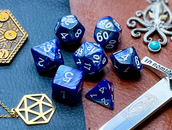 Elemental Steel and Blue resin polyhedral dice set.  Awaken the elements with these fantastic resin dice. Combining vibrant blue and steel swirls; each dice has its own unique pattern.  They are standard 16mm polyhedral dice sets perfect for Tabletop games and RPG's such as pathfinder or dungeons and dragons.  This set includes one of each D20, D12, D10, D%, D8, D6, D4.