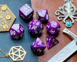 Elemental Steel and Purple resin polyhedral dice set.  Awaken the elements with these fantastic resin dice. Combining vibrant purple and steel swirls; each dice has its own unique pattern.  They are standard 16mm polyhedral dice sets perfect for Tabletop games and RPG's such as pathfinder or dungeons and dragons.  This set includes one of each D20, D12, D10, D%, D8, D6, D4.