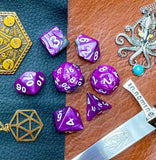 Elemental Steel and Purple resin polyhedral dice set.  Awaken the elements with these fantastic resin dice. Combining vibrant purple and steel swirls; each dice has its own unique pattern.  They are standard 16mm polyhedral dice sets perfect for Tabletop games and RPG's such as pathfinder or dungeons and dragons.  This set includes one of each D20, D12, D10, D%, D8, D6, D4.