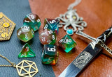 Elemental Gems of the Wind Elves resin polyhedral dice set.  Marvel at the sacred stones of the Wind Elves with these fantastic resin dice. Combining translucent green and blues; each dice has its own unique pattern.  They are standard 16mm polyhedral dice sets perfect for Tabletop games and RPG's such as pathfinder or dungeons and dragons.  This set includes one of each D20, D12, D10, D%, D8, D6, D4.