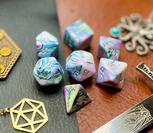 Forbidden Temple Polyhedral Dice Set  Roll with style with these pink, yellow, turquoise and white marbled resin polyhedral dice set.  They are standard 16mm polyhedral dice sets perfect for Tabletop games and RPG's such as pathfinder or dungeons and dragons.  This set includes one of each D20, D12, D10, D%, D8, D6, D4.