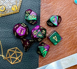 Gemini Green Purple Chessex Dice Set. These genuine Chessex polyhedral dice sets are a perfect addition to any dice collection. They are standard 16mm polyhedral dice sets perfect for Tabletop games and RPG's such as pathfinder or dungeons and dragons. This set includes one of each D20, D12, D10, D%, D8, D6, D4.