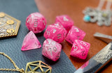 Ghostly Glow Pink Chessex Dice Set  These genuine Chessex polyhedral dice sets are a perfect addition to any dice collection.  They are standard 16mm polyhedral dice sets perfect for Tabletop games and RPG's such as pathfinder or dungeons and dragons.  This set includes one of each D20, D12, D10, D%, D8, D6, D4.  Why Choose Chessex?  Chessex are the market leaders in quality of dice and consistency of roll and have been creating dice for over 30 years