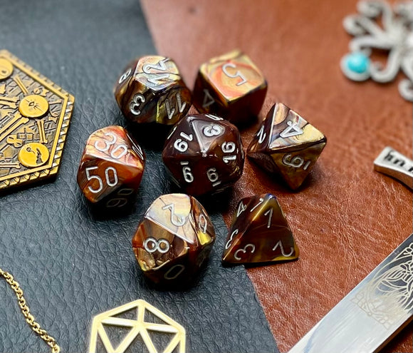 Gold Lustrous Chessex Dice Set  These genuine Chessex polyhedral dice sets are a perfect addition to any dice collection.  They are standard 16mm polyhedral dice sets perfect for Tabletop games and RPG's such as pathfinder or dungeons and dragons.  This set includes one of each D20, D12, D10, D%, D8, D6, D4.  Why Choose Chessex?  Chessex are the market leaders in quality of dice and consistency of roll and have been creating dice for over 30 years