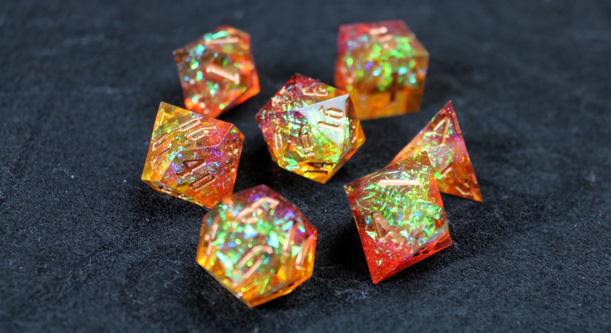 Gold &amp; Orange Glitter Sharp Edge Dice Set

Polished luxury sharp edge dice set

Roll in style with these polyhedral dice sets perfect for Tabletop games and RPG's such as pathfinder or dungeons and dragons.

This set includes one of each D20, D12, D10, D%, D8, D6, D4.

Available both with or without a PU leather dice storage box.