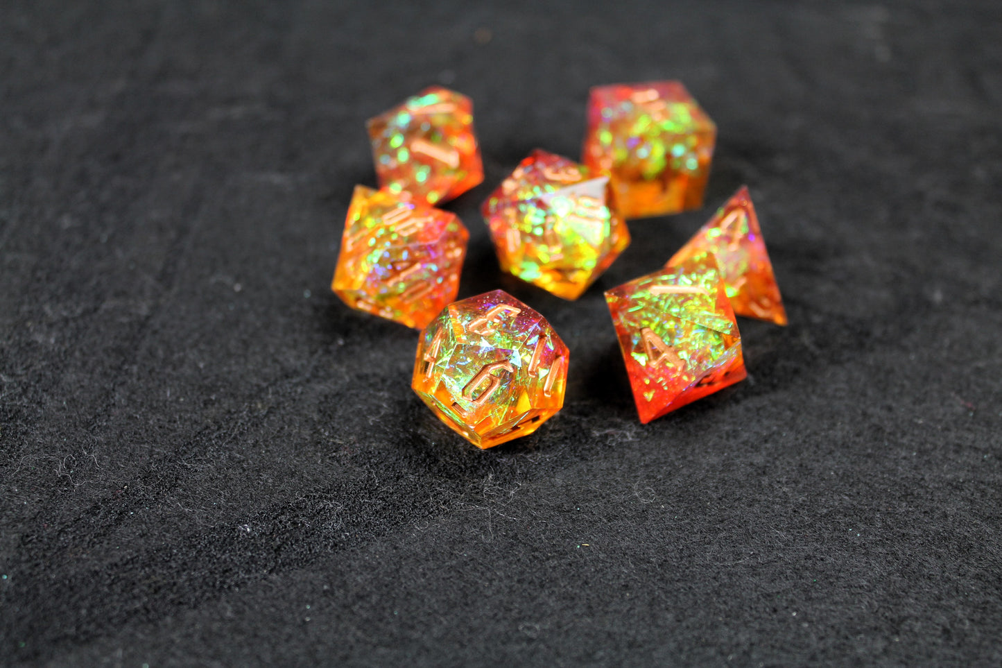 Gold &amp; Orange Glitter Sharp Edge Dice Set

Polished luxury sharp edge dice set

Roll in style with these polyhedral dice sets perfect for Tabletop games and RPG's such as pathfinder or dungeons and dragons.

This set includes one of each D20, D12, D10, D%, D8, D6, D4.

Available both with or without a PU leather dice storage box.