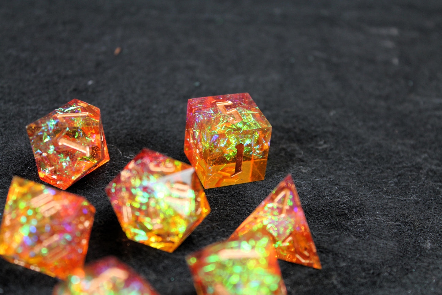 Gold &amp; Orange Glitter Sharp Edge Dice Set

Polished luxury sharp edge dice set

Roll in style with these polyhedral dice sets perfect for Tabletop games and RPG's such as pathfinder or dungeons and dragons.

This set includes one of each D20, D12, D10, D%, D8, D6, D4.

Available both with or without a PU leather dice storage box.