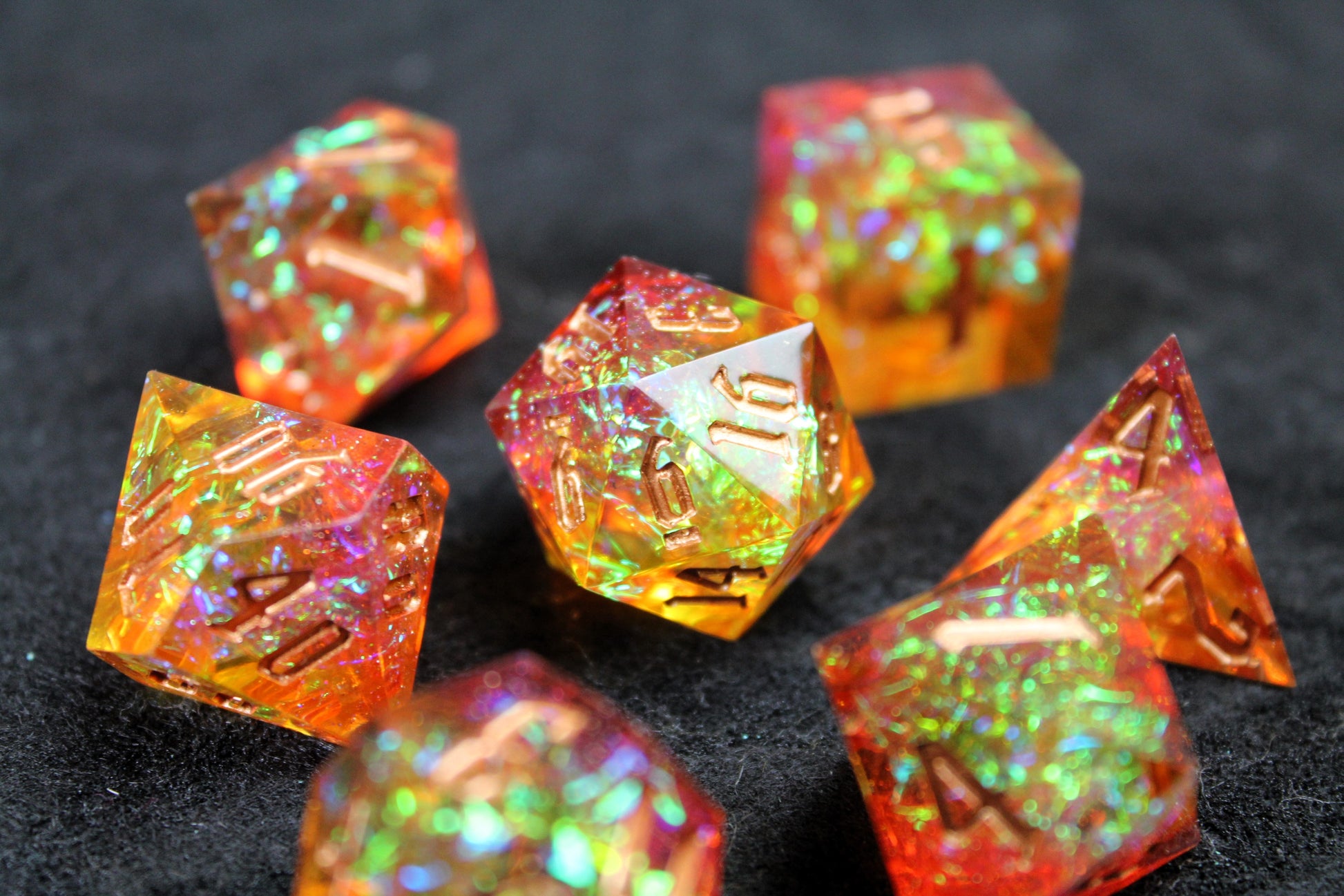 Gold &amp; Orange Glitter Sharp Edge Dice Set

Polished luxury sharp edge dice set

Roll in style with these polyhedral dice sets perfect for Tabletop games and RPG's such as pathfinder or dungeons and dragons.

This set includes one of each D20, D12, D10, D%, D8, D6, D4.

Available both with or without a PU leather dice storage box.