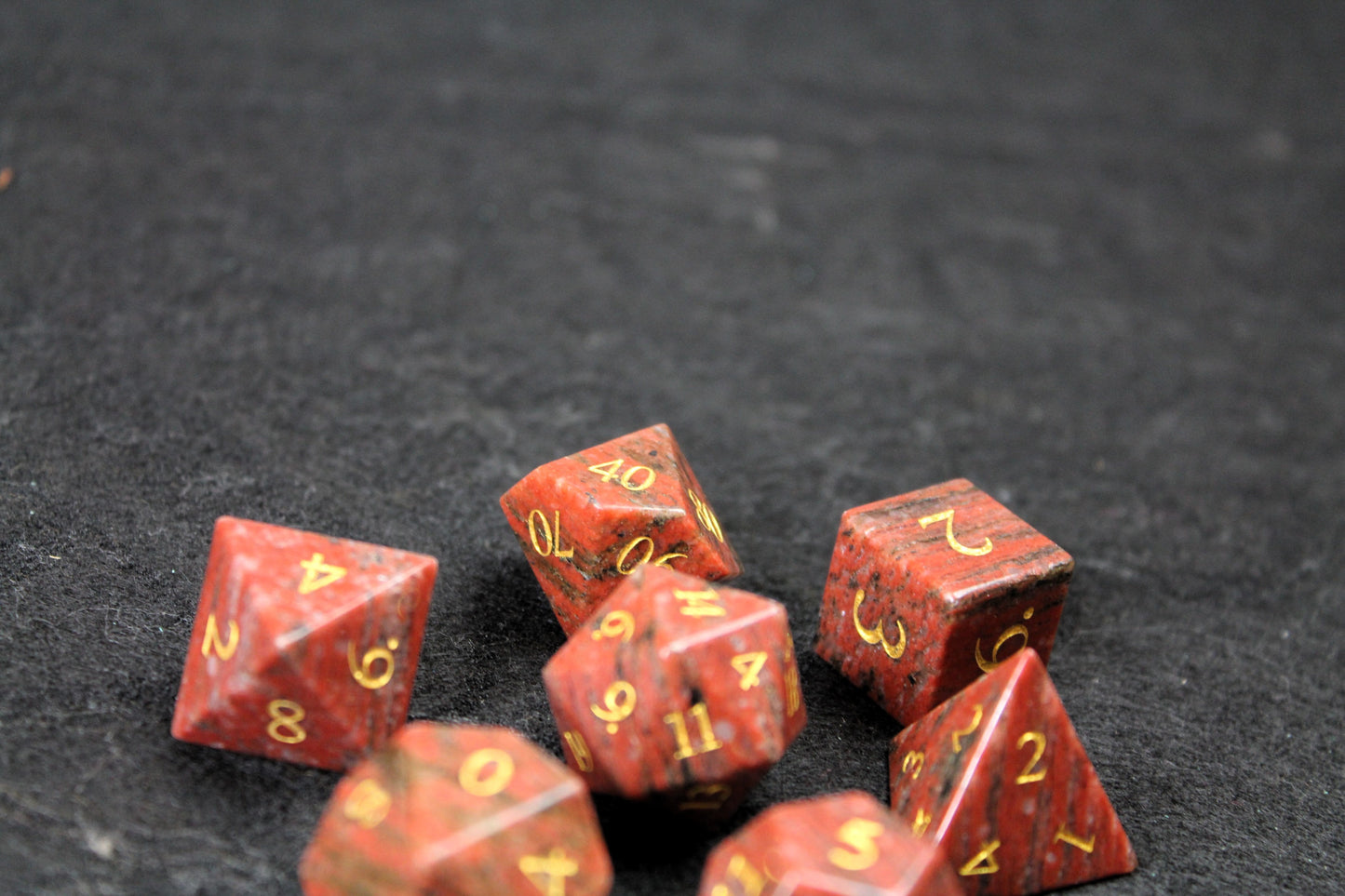 Sesame Red Granite Gemstone Dice Set

Polished Sesame Red Granite gemstone with gold numbers dice set

Roll in style with these polyhedral dice sets perfect for Tabletop games and RPG's such as pathfinder or dungeons and dragons.

This set includes one of each D20, D12, D10, D%, D8, D6, D4.

Available both with or without a PU leather dice storage box.