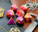 Pavlova Polyhedral Dice Set  Roll sweetly with these white, pink, orange and red marbled resin polyhedral dice set.  They are standard 16mm polyhedral dice sets perfect for Tabletop games and RPG's such as pathfinder or dungeons and dragons.  This set includes one of each D20, D12, D10, D%, D8, D6, D4.