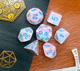 Pop Art Festive Chessex Dice Set  These genuine Chessex polyhedral dice sets are a perfect addition to any dice collection.  They are standard 16mm polyhedral dice sets perfect for Tabletop games and RPG's such as pathfinder or dungeons and dragons.  This set includes one of each D20, D12, D10, D%, D8, D6, D4.  Why Choose Chessex?  Chessex are the market leaders in quality of dice and consistency of roll and have been creating dice for over 30 years