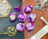 Purple and White Marble Polyhedral Dice Set  Roll with style with these purple and white marbled resin polyhedral dice set.  They are standard 16mm polyhedral dice sets perfect for Tabletop games and RPG's such as pathfinder or dungeons and dragons.  This set includes one of each D20, D12, D10, D%, D8, D6, D4.