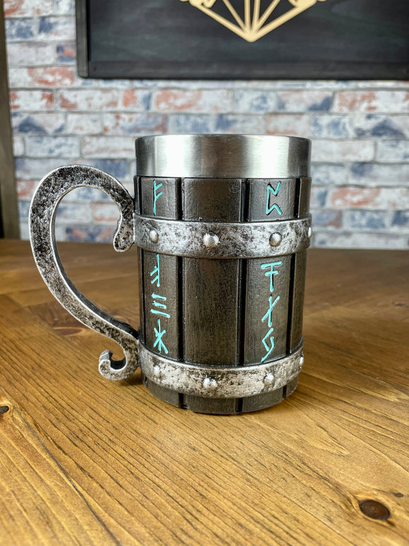 Viking Style Decorative Resin Drinking Tankard With Stainless Steel Insert.  Drink in style with our highly decorative tankard with Norse style runes inscribed down the sides. Holding 500ml you can drink with your clan in style. Perfect for decorating home bars, cosplay, tabletop gaming and all fans of Norse mythology and Viking decoration.