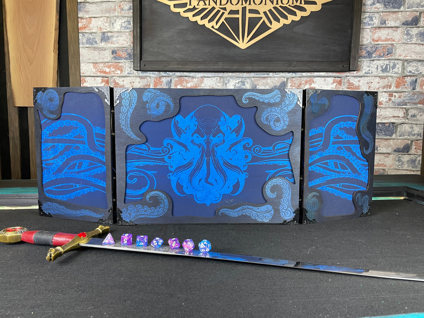 Cthulhu's Curse Dungeon Master Screen is a must-have for any tabletop gaming enthusiast. Crafted from high-quality wood and engraved with intricate designs, this screen is both sturdy and visually stunning. Ideal for tabletop gaming, Dungeons and Dragons, Pathfinder and many other TTRPG's