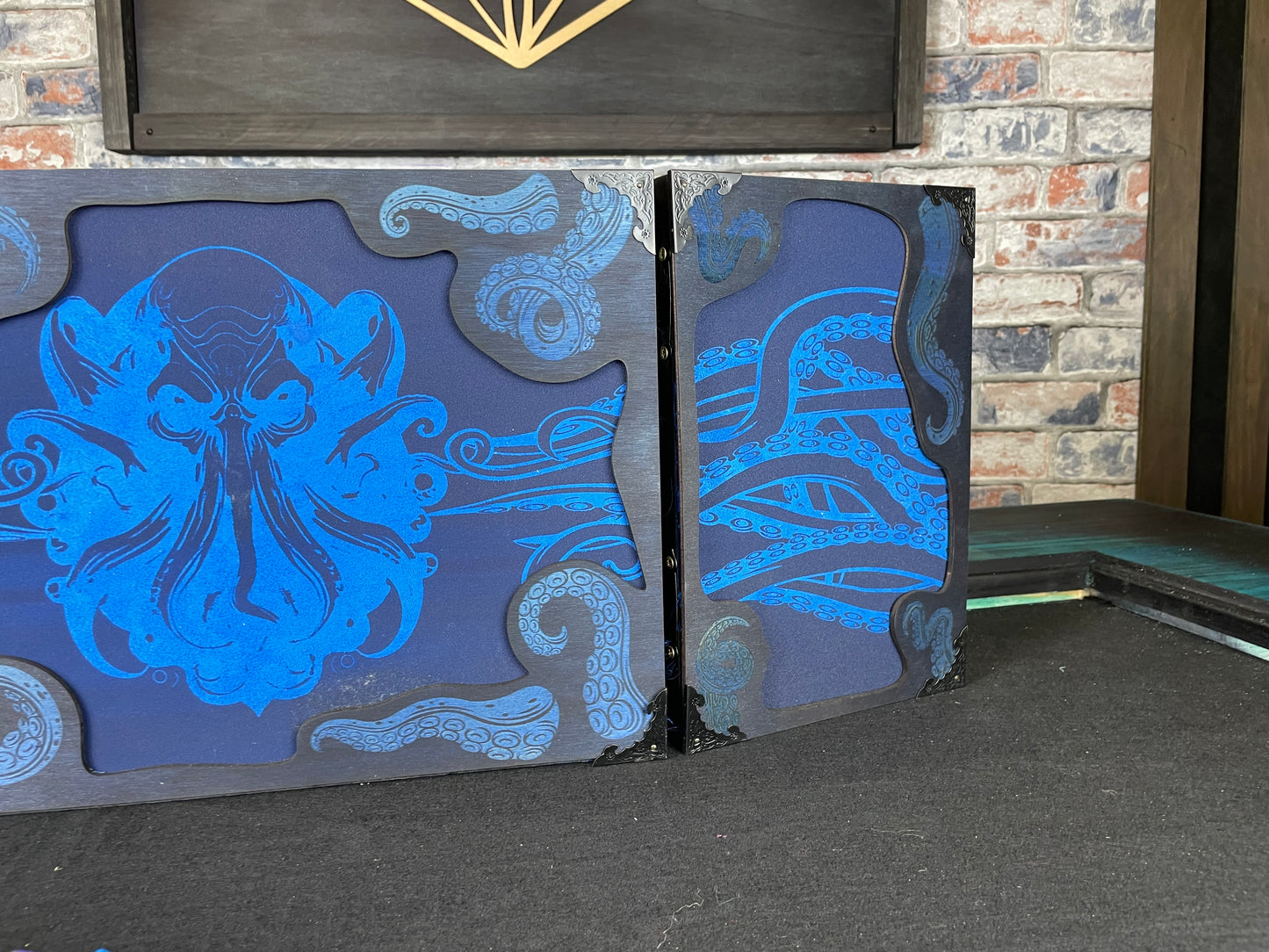 Cthulhu's Curse Dungeon Master Screen is a must-have for any tabletop gaming enthusiast. Crafted from high-quality wood and engraved with intricate designs, this screen is both sturdy and visually stunning. Ideal for tabletop gaming, Dungeons and Dragons, Pathfinder and many other TTRPG's