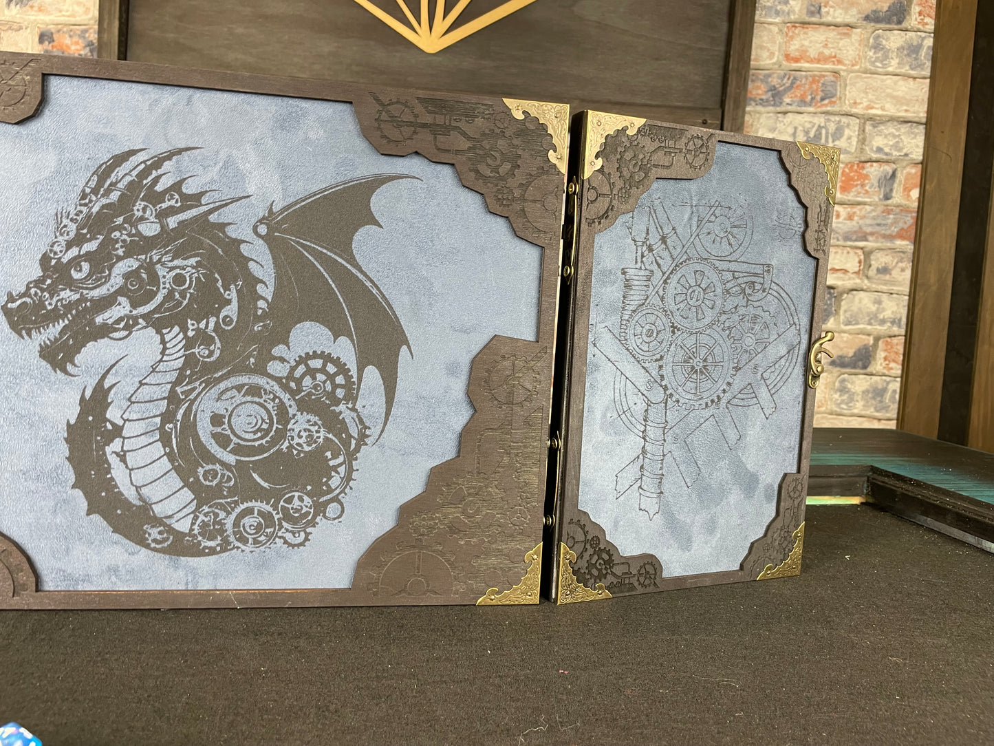 Draco Machina Dungeon Master Screen is a must-have for any tabletop gaming enthusiast. Crafted from high-quality wood and engraved with intricate designs, this screen is both sturdy and visually stunning. Ideal for tabletop gaming, Dungeons and Dragons, Pathfinder and many other TTRPG's