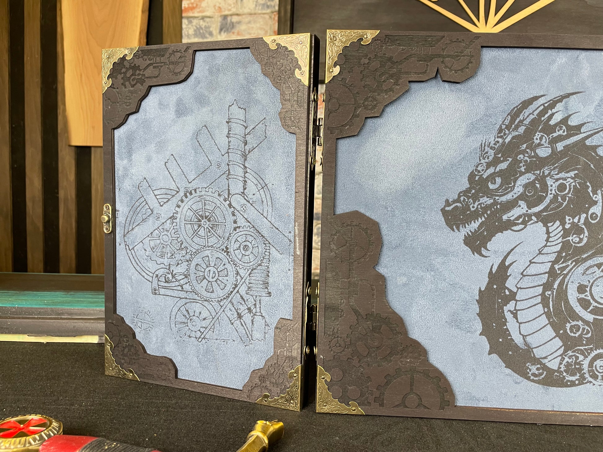 Draco Machina Dungeon Master Screen is a must-have for any tabletop gaming enthusiast. Crafted from high-quality wood and engraved with intricate designs, this screen is both sturdy and visually stunning. Ideal for tabletop gaming, Dungeons and Dragons, Pathfinder and many other TTRPG's