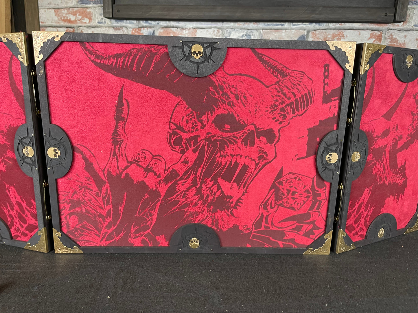 Dice With The Devil Dungeon Master Screen is a must-have for any tabletop gaming enthusiast. Crafted from high-quality wood and engraved with intricate designs, this screen is both sturdy and visually stunning. Ideal for tabletop gaming, Dungeons and Dragons, Pathfinder and many other TTRPG's