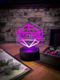 Light up LED Personalised D20 Light. Your custom personalised D20 acrylic fits into a colour changing, remote controlled LED light box, enabling you to change the colour of your light, brightness and on/off at the touch of a button.