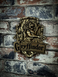 Discover the Wizarding World with this Officially Licensed bronze Harry Potter  Gryffinfor Wall Plaque. Featuring a lion as the centre of this piece which is the emblematic animal of the Gryffindor house, whose members are characterised by their cunning minds, ambition and pride. This Wall Plaque really will be a showstopper in any display. Cast in the finest resin before being given a bronze finish, this piece is perfect for any Witches, Wizards, or Muggles alike!