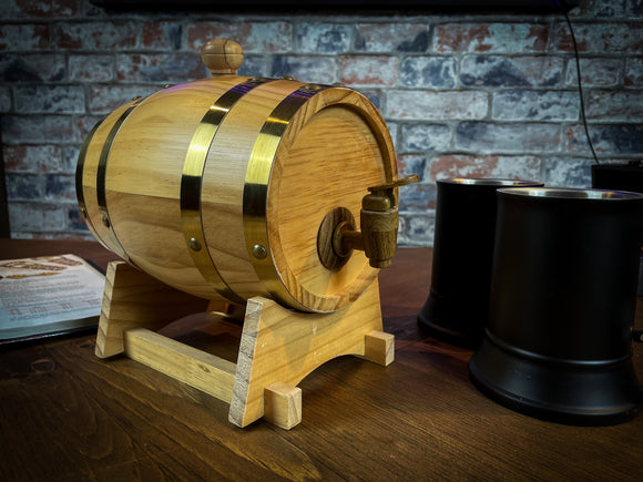 1.5L solid wood beer and wine barrel with tap. Perfect for holding your beverage of choice and maintaining your tavern feel around your table.  Featuring a removable tap to fill your plastic lined barrel it is super easy to refill and wash out. Also comes with a wooden stand to hold your barrel in place. Free UK Delivery with Fandomonium