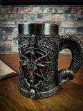 This occult tankard is a macabre lovers dream. Each side of the body has a small patent red background which sits under a raised pentagram, the words 'Solve' and 'Coagula' adorn its outer circle. Atop this the head of a triple-horned Sabbatic Goat with a pentagram raised from its skull. Free UK delivery buy Fandomonium