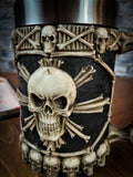 Cast in the finest resin before being painstakingly hand-painted. The base of this tankard is ringed with grinning skulls facing outwards. Above them, the sides bear a large skull, set in the centre of an 8-pointed star made of bones and ringed in a border of bones.