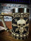 Cast in the finest resin before being painstakingly hand-painted. The base of this tankard is ringed with grinning skulls facing outwards. Above them, the sides bear a large skull, set in the centre of an 8-pointed star made of bones and ringed in a border of bones.
