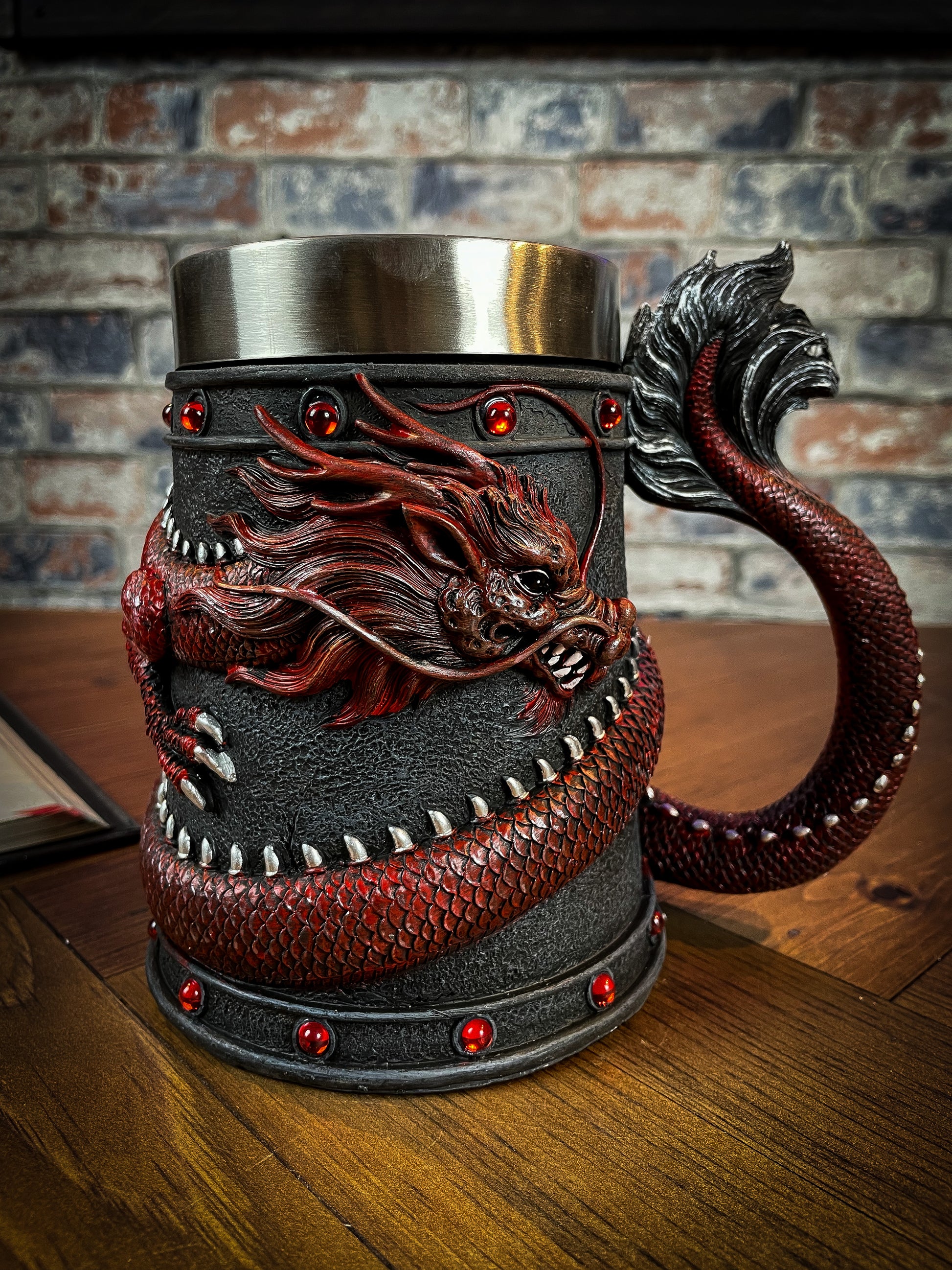 Drink deeply of a rich fantasy world with this enchanting Dragon Coil Tankard. Designed with a red onyx Dragon wrapped around the entirety of the tankard, jealously guarding the red jewels and your precious drink. Free UK Delivery from Fandomonium