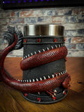 Drink deeply of a rich fantasy world with this enchanting Dragon Coil Tankard. Designed with a red onyx Dragon wrapped around the entirety of the tankard, jealously guarding the red jewels and your precious drink. Free UK Delivery from Fandomonium