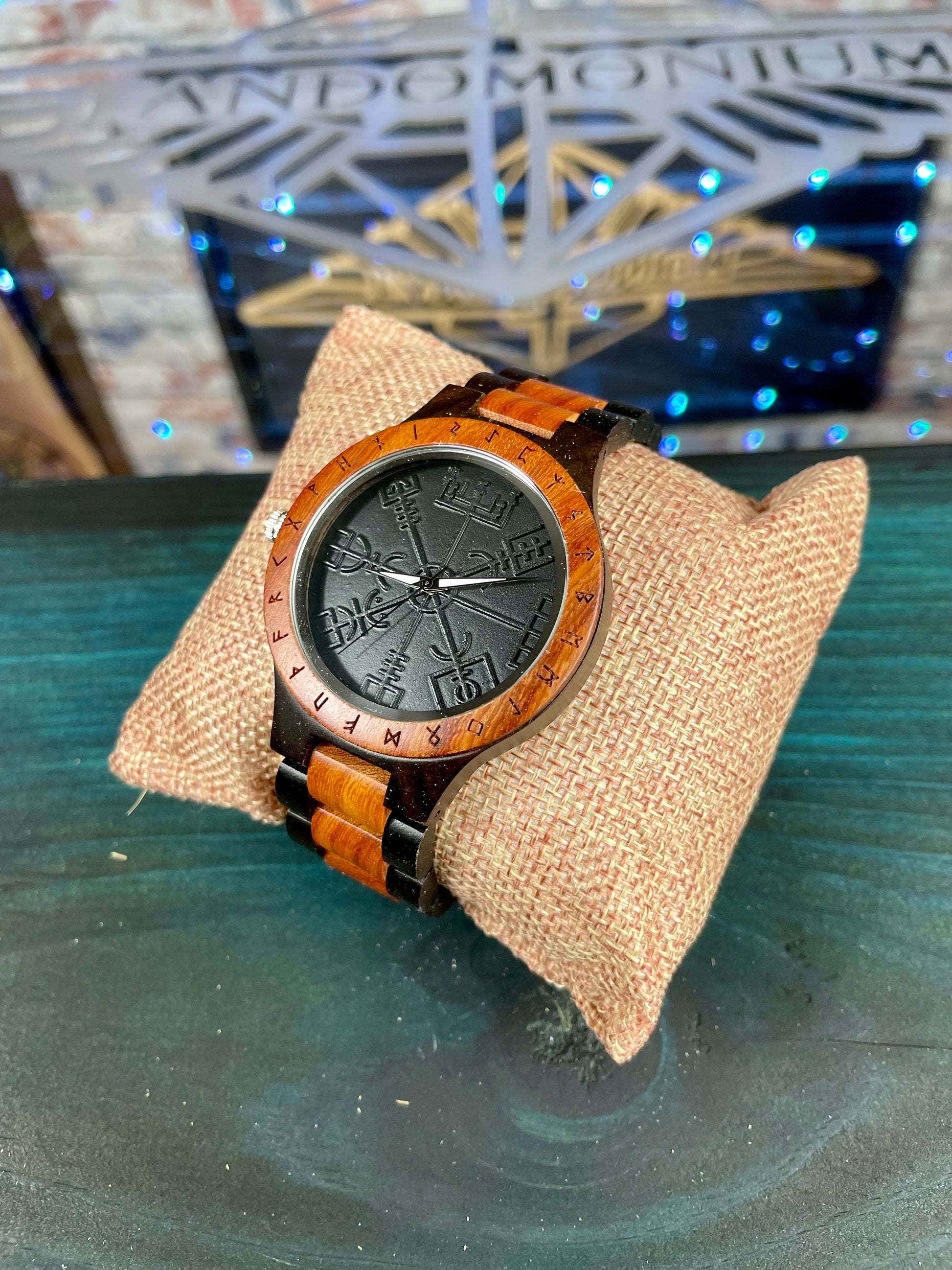 Wooden Norse Viking Design Watch. A unique style of watch with the strap, front and back of the watch all made from highly polished wood. Each time piece comes in a wooden display box and makes a perfect gift for fans of Norse Mythology and Viking Style. Complete with the Vegvisir Viking wayfinder on the watch face giving a unique and stylish look. Each watch also comes with a tool to help you add and remove links and a care &amp; instruction manual.