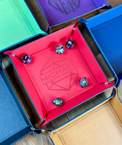 ersonalised Square Dice Tray  Stud fixing lay flat dice rolling tray. Made from PU leather and available in a choice of 6 vibrant colours; these trays are easy to transport and store while looking great.&nbsp;  Engrave your tray with a choice of 24 different designs.&nbsp;