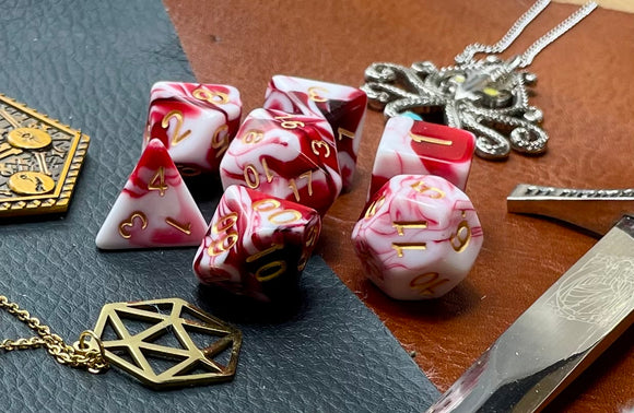 Red and White Marble Polyhedral Dice Set  Roll with style with these red and white marbled resin polyhedral dice set.  They are standard 16mm polyhedral dice sets perfect for Tabletop games and RPG's such as pathfinder or dungeons and dragons.  This set includes one of each D20, D12, D10, D%, D8, D6, D4.