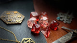 Red Nebula Chessex Dice Set  These genuine Chessex polyhedral dice sets are a perfect addition to any dice collection.  They are standard 16mm polyhedral dice sets perfect for Tabletop games and RPG's such as pathfinder or dungeons and dragons.  This set includes one of each D20, D12, D10, D%, D8, D6, D4.  Why Choose Chessex?  Chessex are the market leaders in quality of dice and consistency of roll and have been creating dice for over 30 years