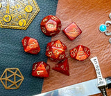 Scarlet Gold Scarab Chessex Dice Set  These genuine Chessex polyhedral dice sets are a perfect addition to any dice collection.  They are standard 16mm polyhedral dice sets perfect for Tabletop games and RPG's such as pathfinder or dungeons and dragons.  This set includes one of each D20, D12, D10, D%, D8, D6, D4.  Why Choose Chessex?  Chessex are the market leaders in quality of dice and consistency of roll and have been creating dice for over 30 years