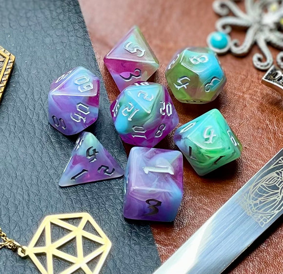 Sea Elves Polyhedral Dice Set  Take to the seas with these purple and green marbled resin polyhedral dice set.  They are standard 16mm polyhedral dice sets perfect for Tabletop games and RPG's such as pathfinder or dungeons and dragons.  This set includes one of each D20, D12, D10, D%, D8, D6, D4.