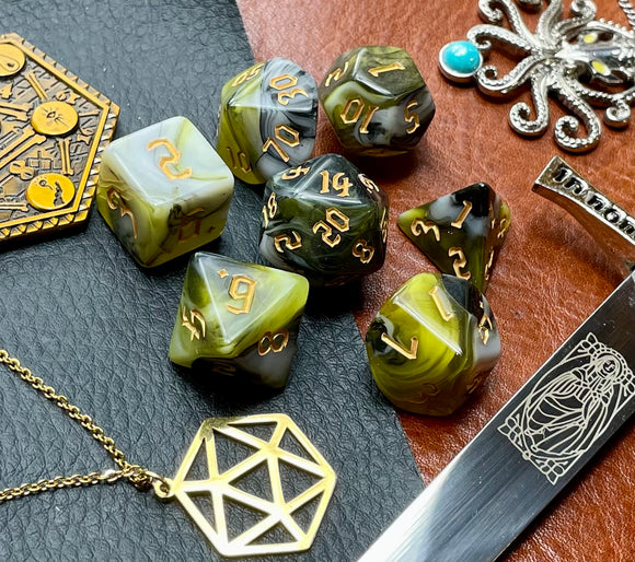 From The Depths Polyhedral Dice Set  Explore the deep with these black, green and yellow marbled resin polyhedral dice set.  They are standard 16mm polyhedral dice sets perfect for Tabletop games and RPG's such as pathfinder or dungeons and dragons.  This set includes one of each D20, D12, D10, D%, D8, D6, D4.