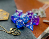 Sapphire Phantom Polyhedral Dice Sett  Enter the spirit realm blue and purple swirl resin polyhedral dice set.  They are standard 16mm polyhedral dice sets perfect for Tabletop games and RPG's such as pathfinder or dungeons and dragons.  This set includes one of each D20, D12, D10, D%, D8, D6, D4.