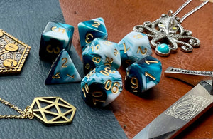 Teal and White Marble Polyhedral Dice Set  Roll with style with these teal and white marbled resin polyhedral dice set.  They are standard 16mm polyhedral dice sets perfect for Tabletop games and RPG's such as pathfinder or dungeons and dragons.  This set includes one of each D20, D12, D10, D%, D8, D6, D4.