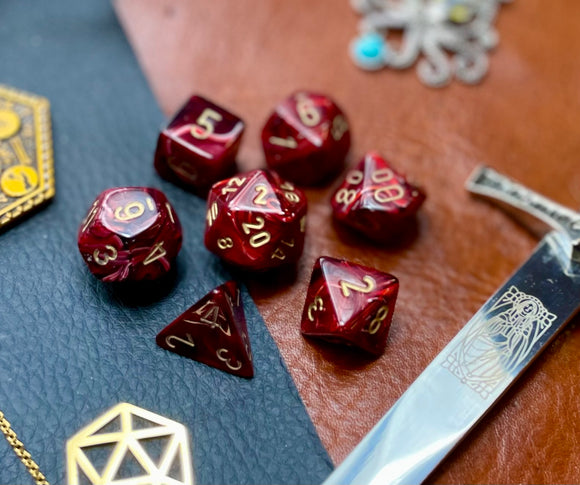 Burgundy Vortex Chessex Dice Set. These genuine Chessex polyhedral dice sets are a perfect addition to any dice collection. They are standard 16mm polyhedral dice sets perfect for Tabletop games and RPG's such as pathfinder or dungeons and dragons. This set includes one of each D20, D12, D10, D%, D8, D6, D4.
