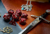 Burgundy Vortex Chessex Dice Set. These genuine Chessex polyhedral dice sets are a perfect addition to any dice collection. They are standard 16mm polyhedral dice sets perfect for Tabletop games and RPG's such as pathfinder or dungeons and dragons. This set includes one of each D20, D12, D10, D%, D8, D6, D4.