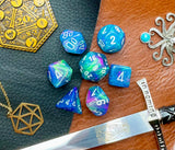 Waterlilly Chessex Festive Dice Set  These genuine Chessex polyhedral dice sets are a perfect addition to any dice collection.  They are standard 16mm polyhedral dice sets perfect for Tabletop games and RPG's such as pathfinder or dungeons and dragons.  This set includes one of each D20, D12, D10, D%, D8, D6, D4.  Why Choose Chessex?  Chessex are the market leaders in quality of dice and consistency of roll and have been creating dice for over 30 years