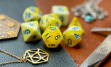 Yellow and White Marble Polyhedral Dice Set  Roll with style with these yellow and white marbled resin polyhedral dice set.  They are standard 16mm polyhedral dice sets perfect for Tabletop games and RPG's such as pathfinder or dungeons and dragons.  This set includes one of each D20, D12, D10, D%, D8, D6, D4.