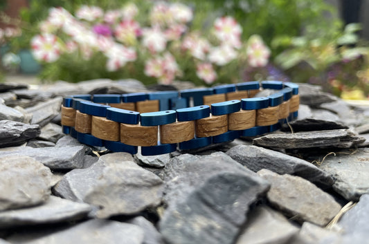 Zebrano & Metal Bracelet

Made from solid "Zebra Wood" Zebrano and blue anodised stainless steel; these bracelets are both comfortable to wear and a unique piece of jewellery.