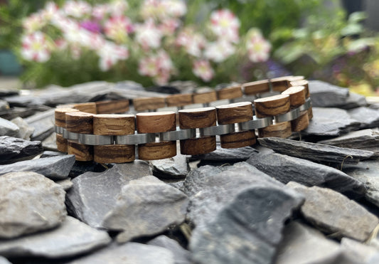 Zebrano and Polished Stainless Steel Bracelet

Made from solid zebrano and highly polished stainless steel; these bracelets are both comfortable to wear and a unique piece of jewellery.
